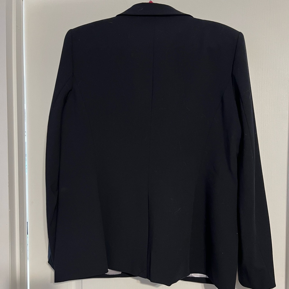 Calvin Klein suit jacket in navy blue. Size 16. New without tags